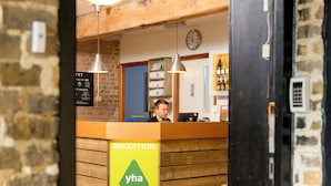 A reception desk with a sign reading "RECEPTION Welcome to YHA Medway". - YHA Medway - Hostel (Gillingham)