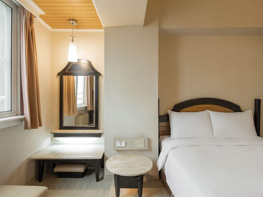 Standard Double Room | Living area | 32-inch LED TV with cable channels, TV
