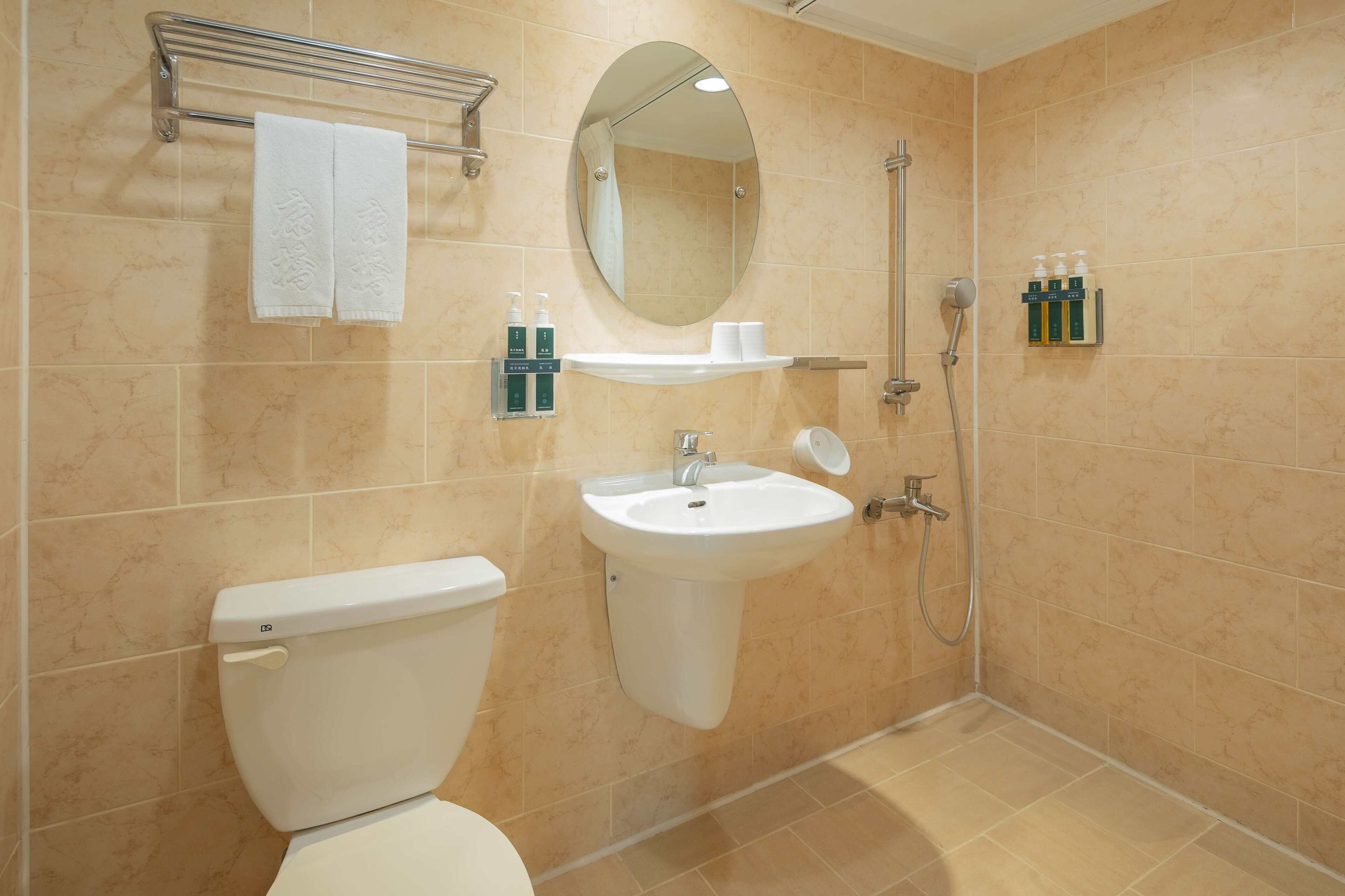 Shower, hair dryer, slippers, towels