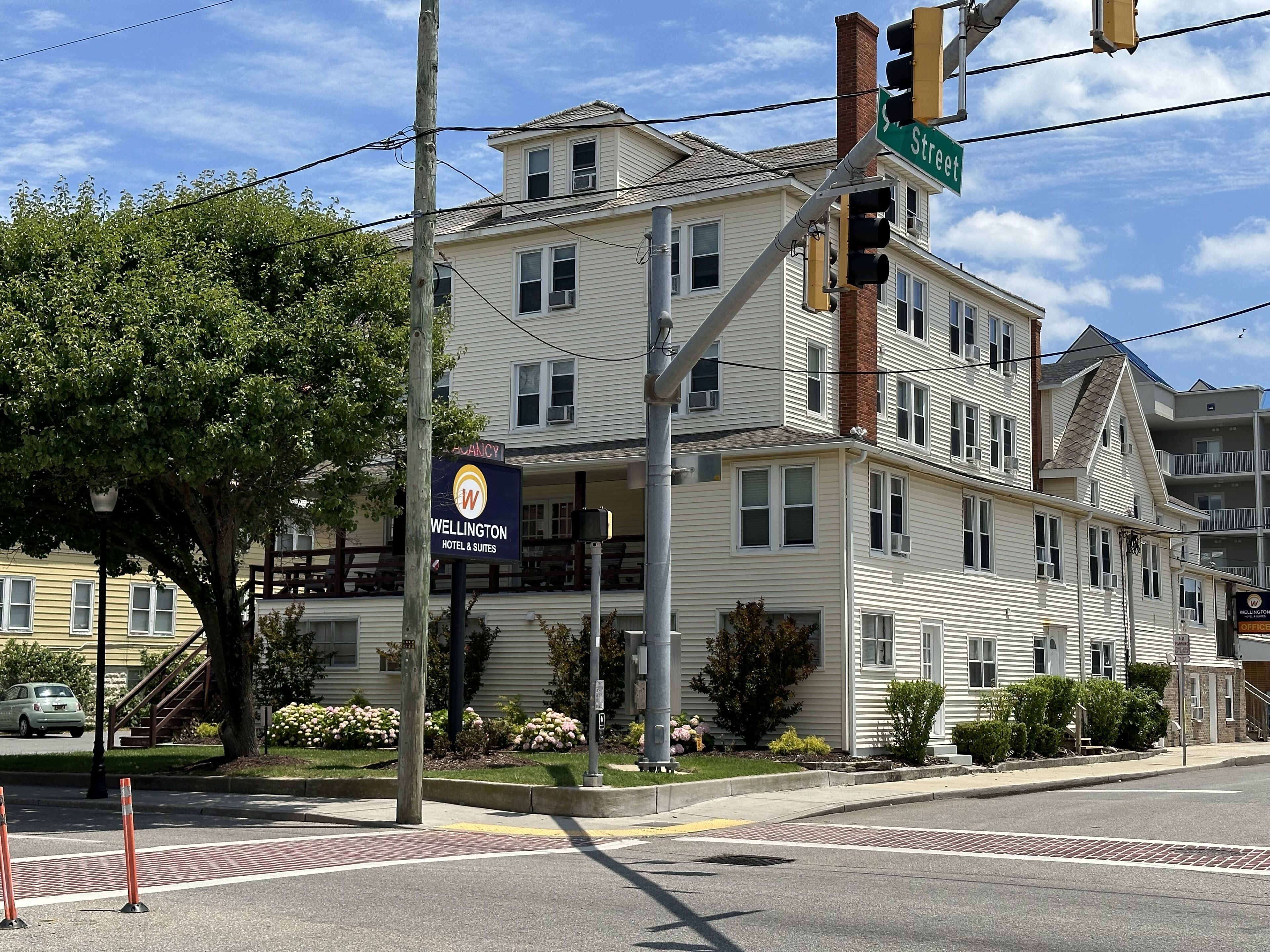 A hotel with a sign indicating it is a WELWELTON HOTEL & SUITES.