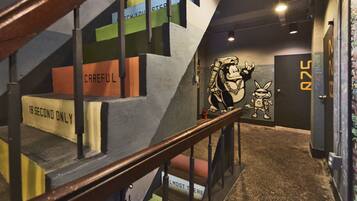 A staircase with colorful steps and signs, including "18 SECOND ONLY" and "ALMOST THERE."