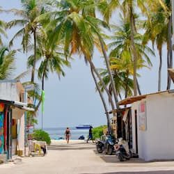 Beach nearby, white sand, beach umbrellas, beach towels
