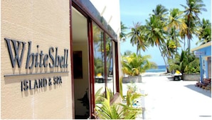A building with a sign reading "WhiteShell Island & Spa". - WhiteShell Island Hotel & Spa (Maafushi)