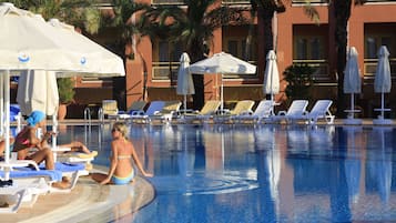 2 outdoor pools, open 7:00 AM to 8:00 PM, pool umbrellas, pool loungers