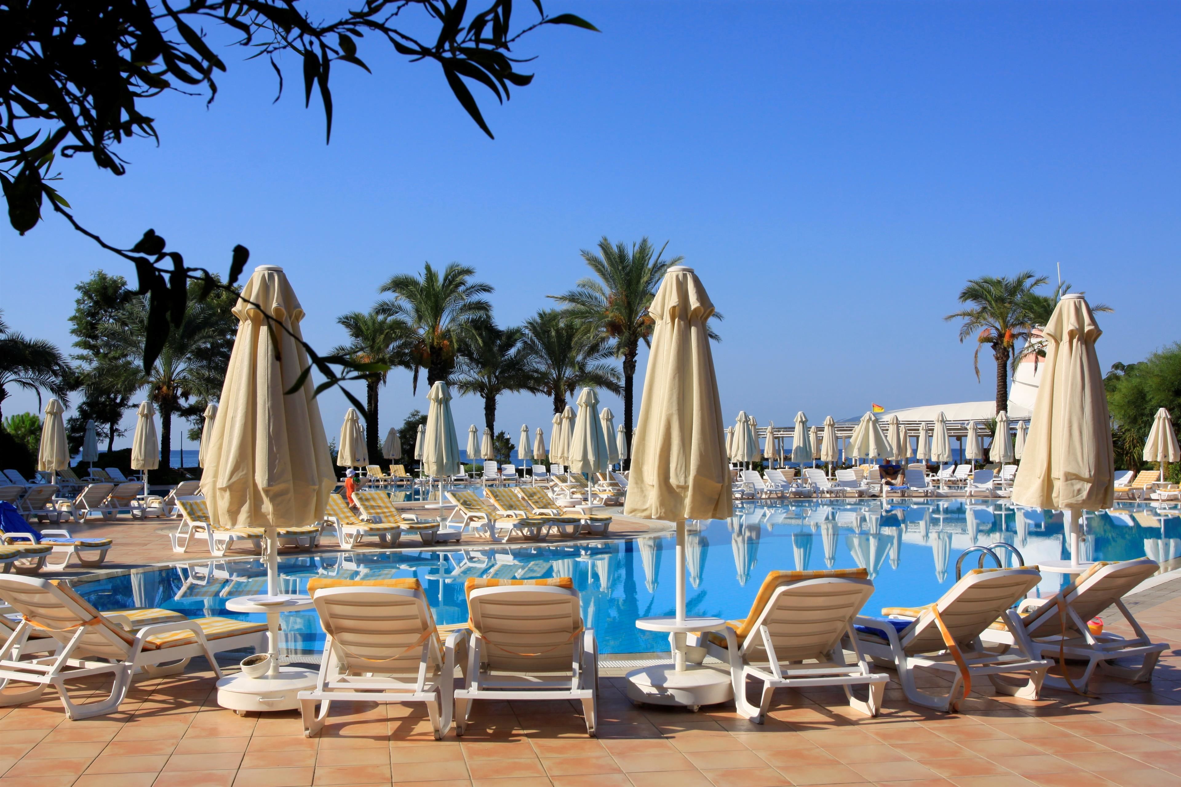 2 outdoor pools, open 7:00 am to 8:00 pm, pool umbrellas, pool loungers