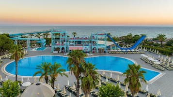 Indoor pool, outdoor pool, pool umbrellas, pool loungers