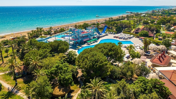A resort with a large pool, water slides, and a beach. - Asteria Family Resort Belek (Ex. Aquaworld Belek) - All inclusive (Serik)