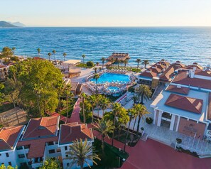 A resort with a swimming pool, beach area, and ocean view. - Corendon Hydros Club Kemer (Kemer)