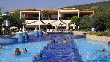 Indoor pool, 7 outdoor pools, open 8 AM to 7 PM, pool umbrellas
