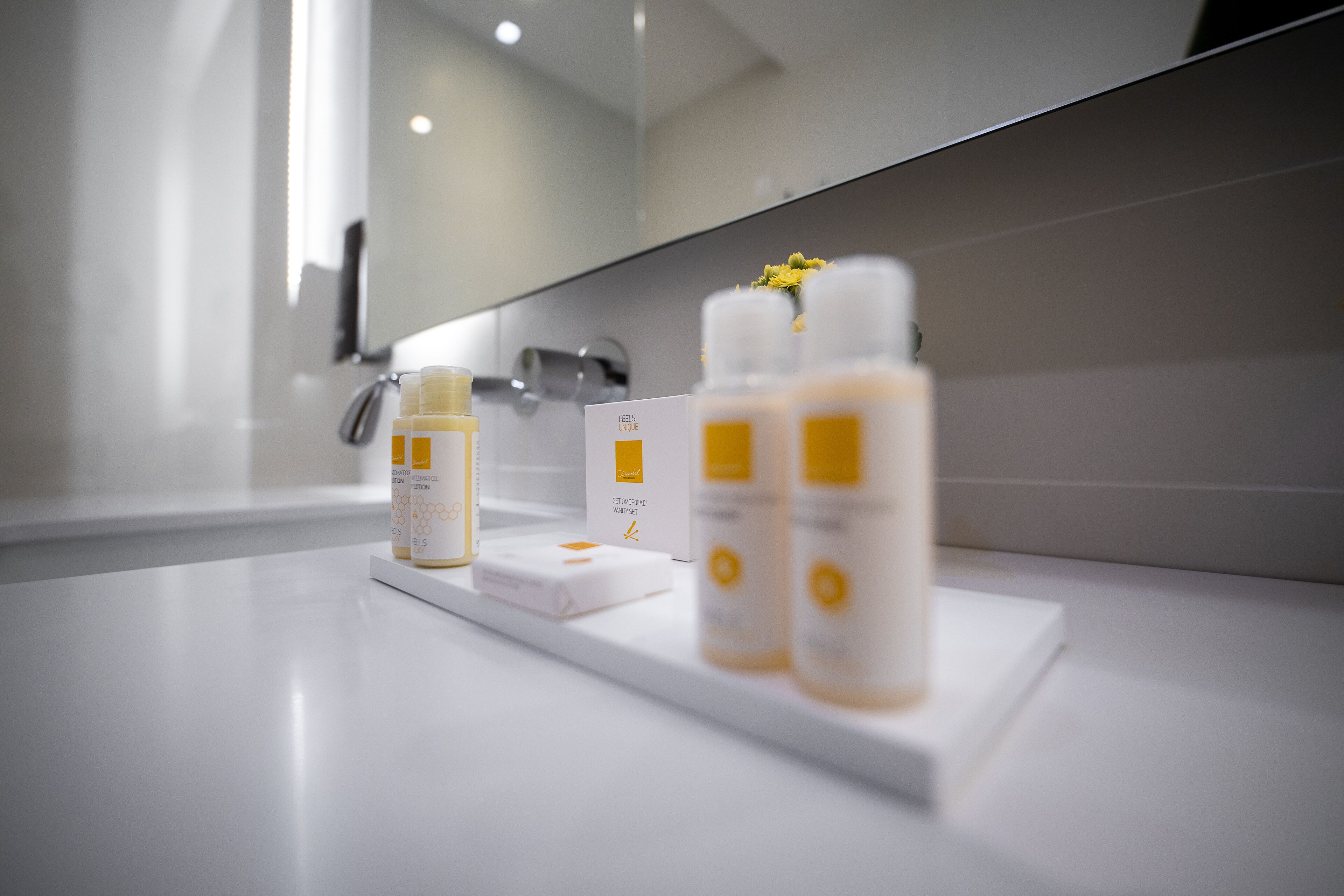 designer toiletries, hair dryer, bathrobes, slippers