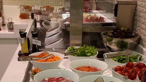 A buffet with various food items including salads, fruits, and dips. - Warwick Ankara (Ankara)