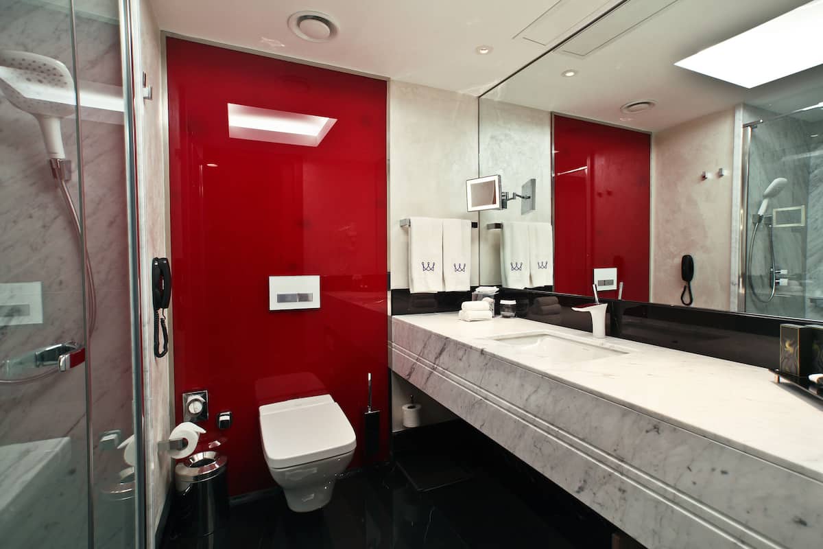 rainfall showerhead, designer toiletries, hair dryer, slippers