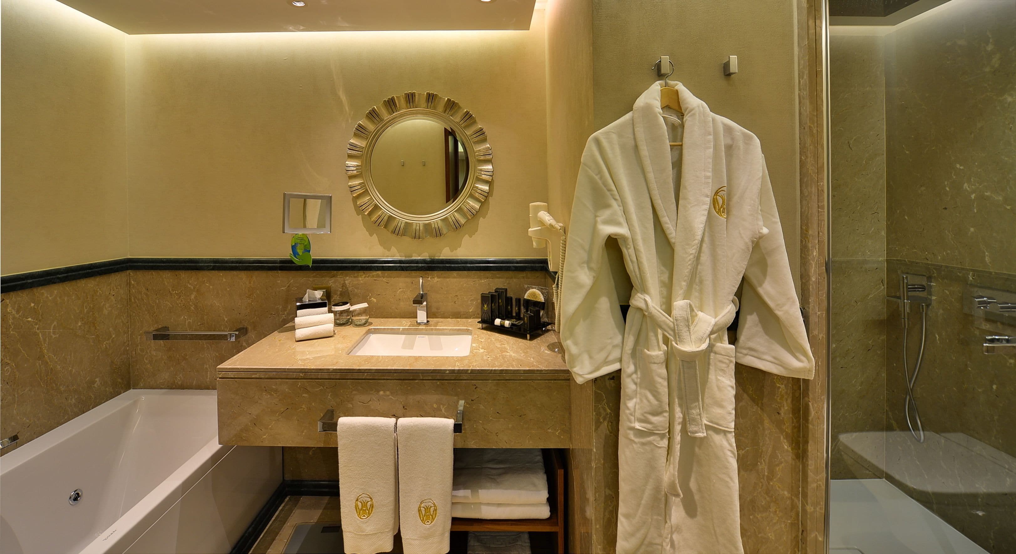 royal suite | bathroom | rainfall showerhead, designer toiletries, hair dryer, slippers