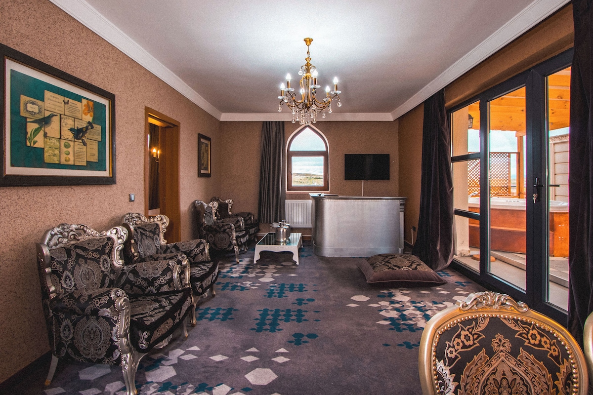 Suite, 1 cama King size | Área de sala de estar