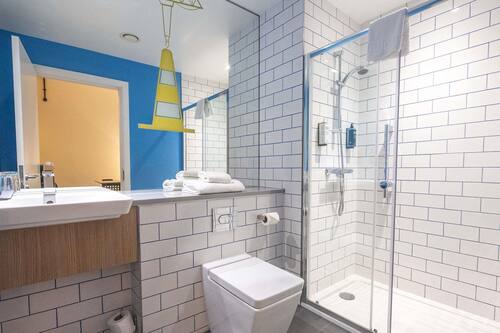 Shower, eco-friendly toiletries, hair dryer, towels