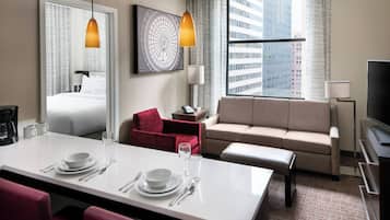 Premium bedding, desk, laptop workspace, iron/ironing board