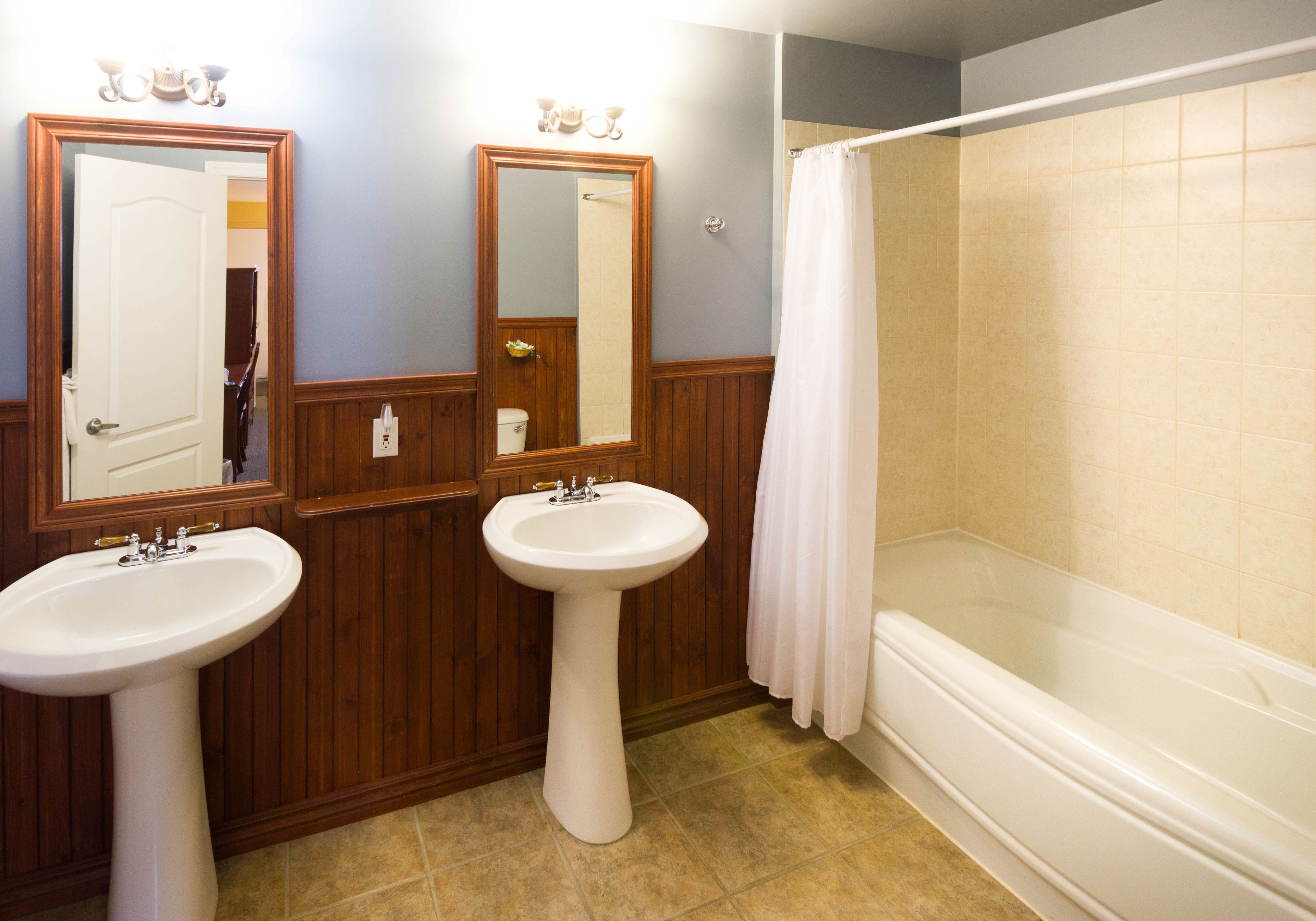 classic room, 2 queen beds | bathroom | free toiletries, hair dryer, towels