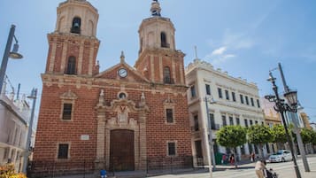 A historic church with two bell towers and a large central door.