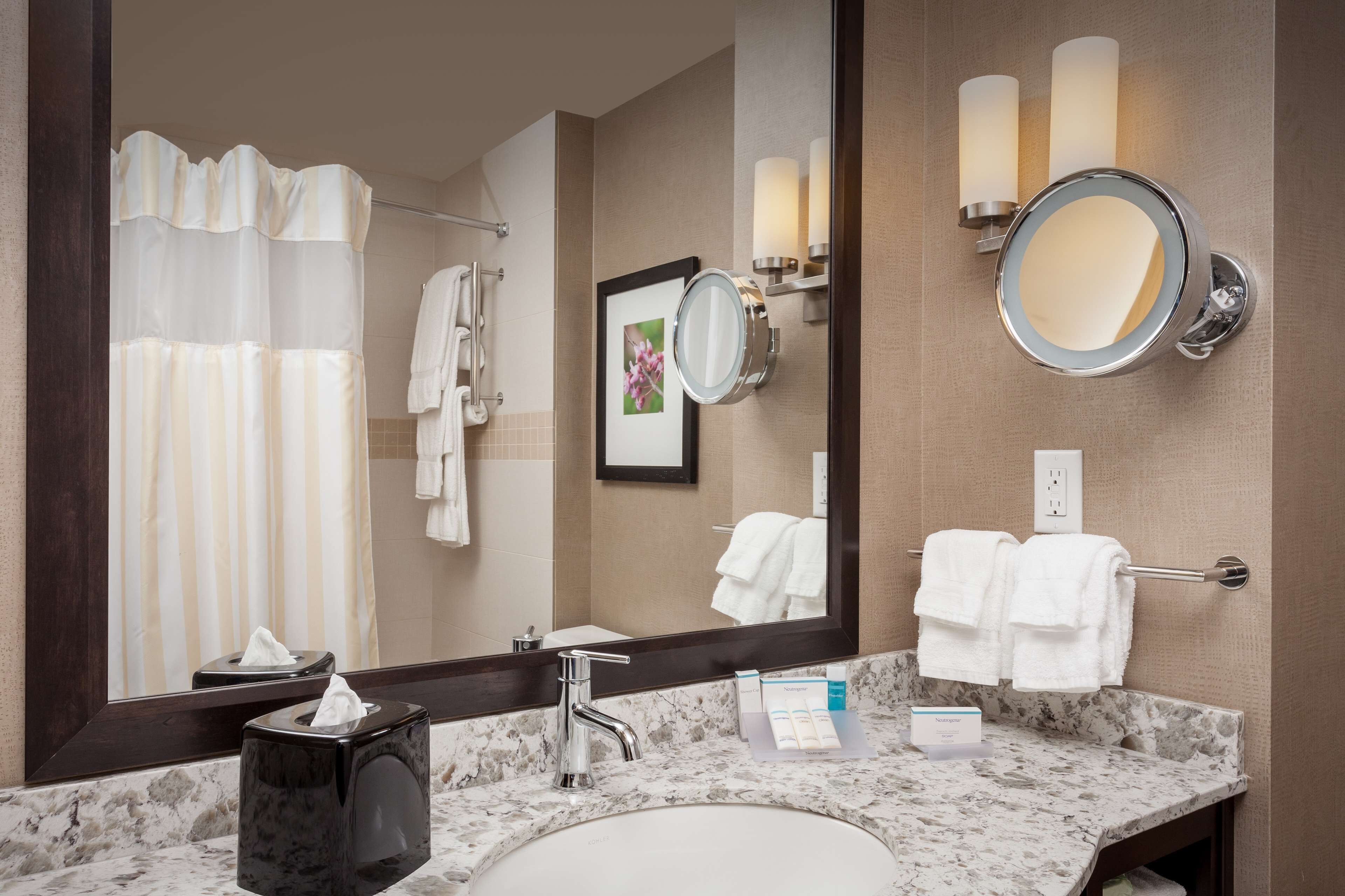 designer toiletries, hair dryer, towels, soap