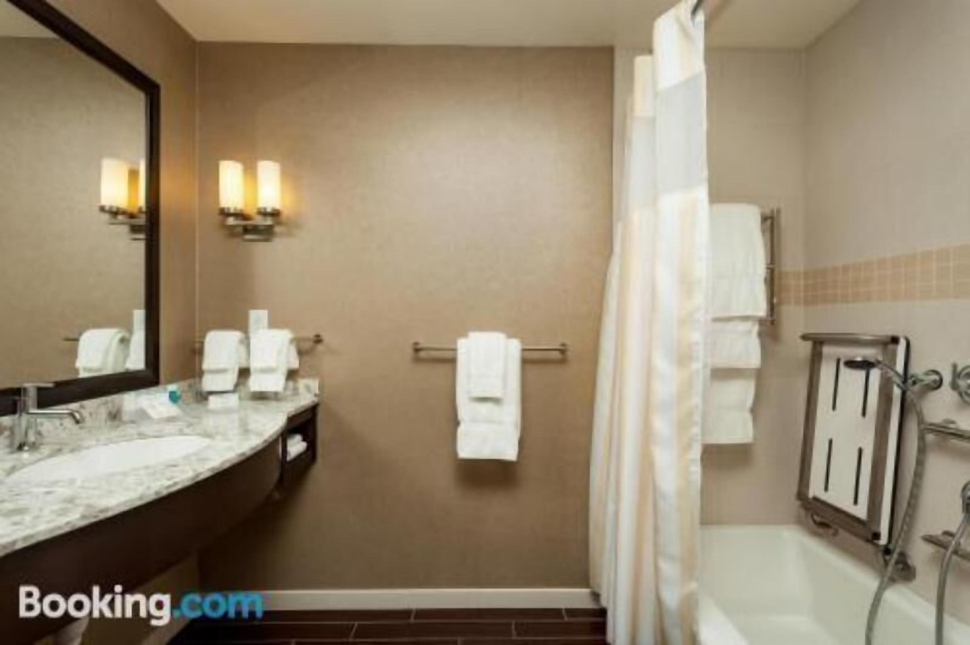 Bathroom | Designer toiletries, hair dryer, towels, soap