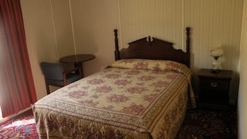 Desk, blackout drapes, bed sheets
