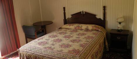 Desk, blackout curtains, bed sheets