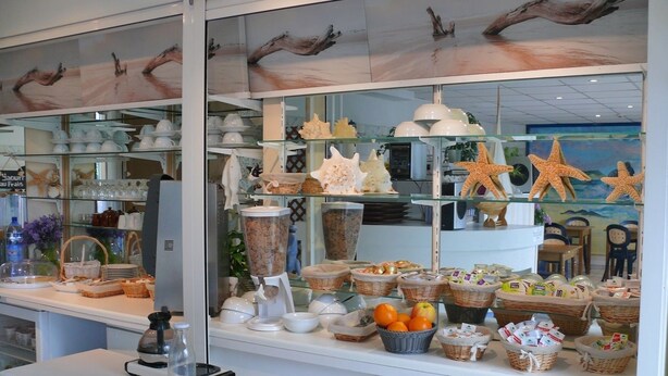 A bakery display with various baked goods and decorative items.