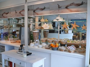 A bakery display with various baked goods and decorative items.