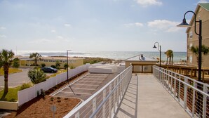 Beach nearby, white sand, sun loungers