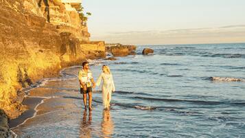 Private beach, black sand, sun loungers, beach towels