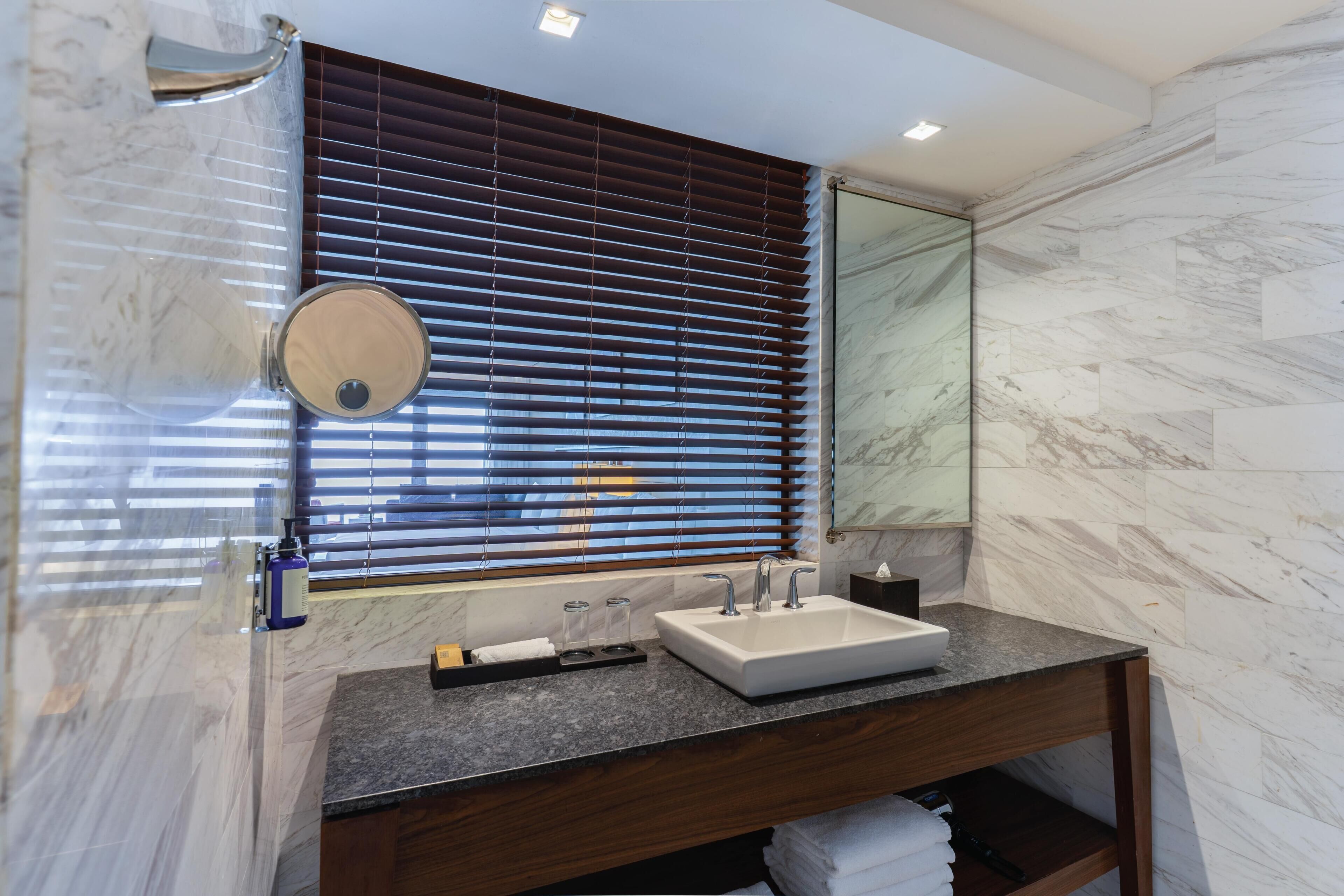 Standard Room, 2 Queen Beds | Bathroom | Rainfall showerhead, free toiletries, hair dryer, towels