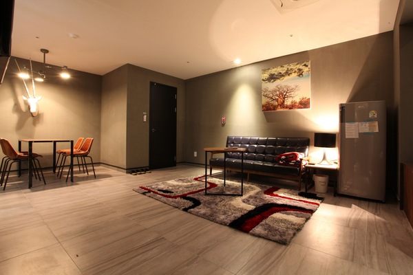 VIP Room | Living area | Flat-screen TV, computer