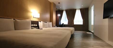 Deluxe Quadruple Room, 2 Double Beds | Down comforters, desk, blackout drapes, bed sheets