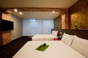 A hotel room with two beds, a brick wall, a flat-screen TV, and a door leading to a bathroom. - Hotel 6 - ZhongHua (Taipei)