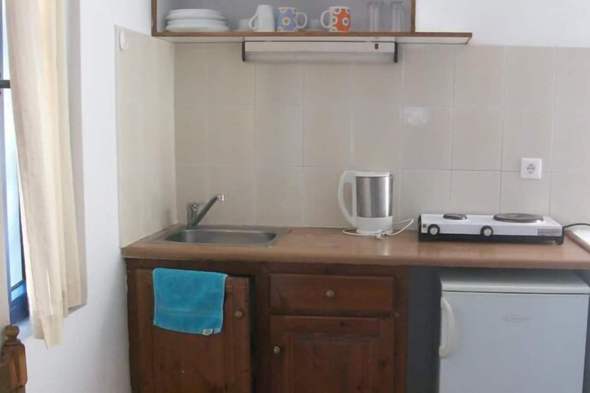 Fridge, coffee/tea maker, cookware/dishes/utensils