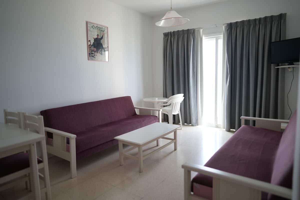 Apartment, 1 Bedroom, Partial Sea View | Living area | TV