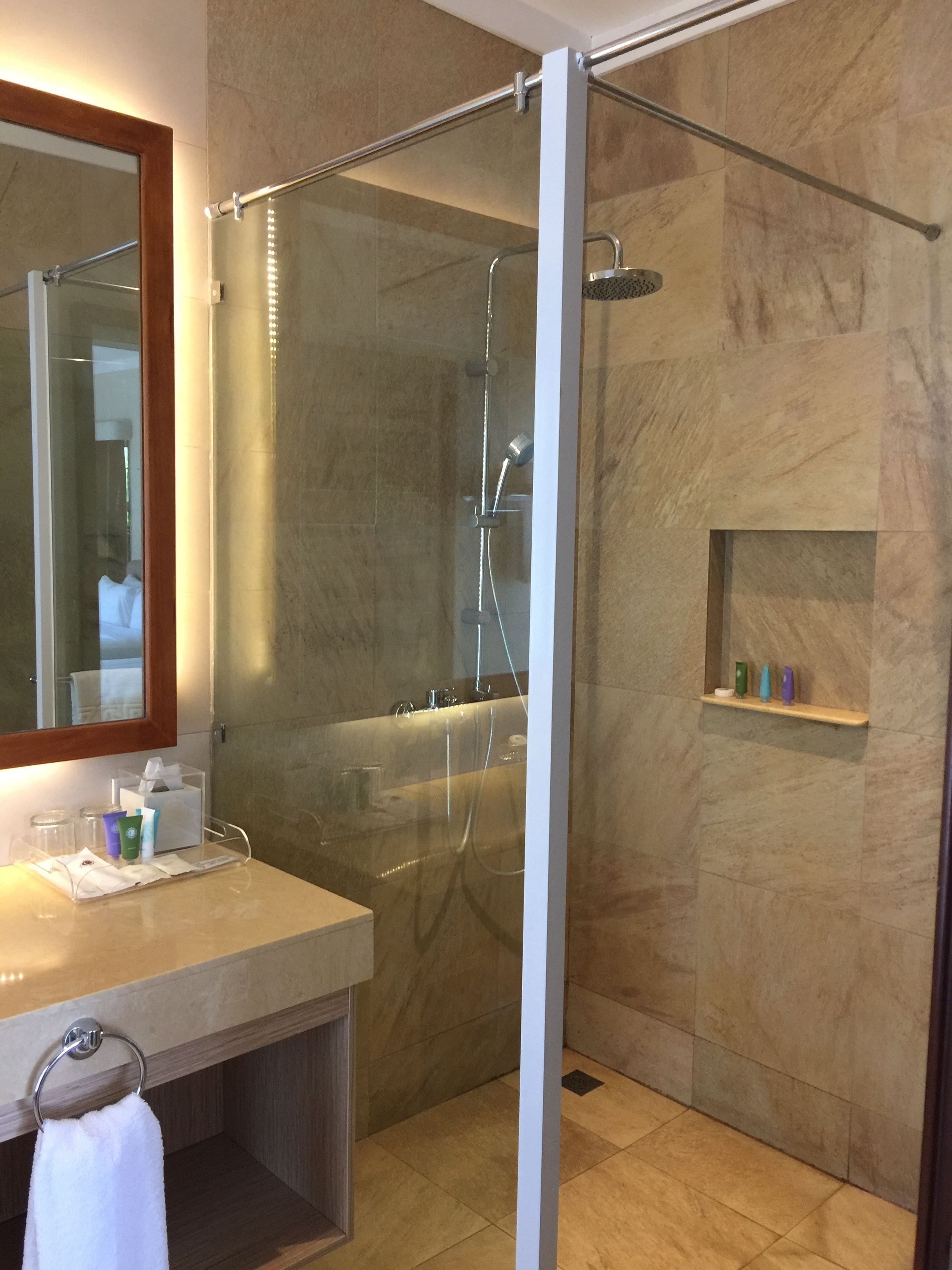 ocean room, 2 queen beds | bathroom | shower, rainfall showerhead, designer toiletries, hair dryer