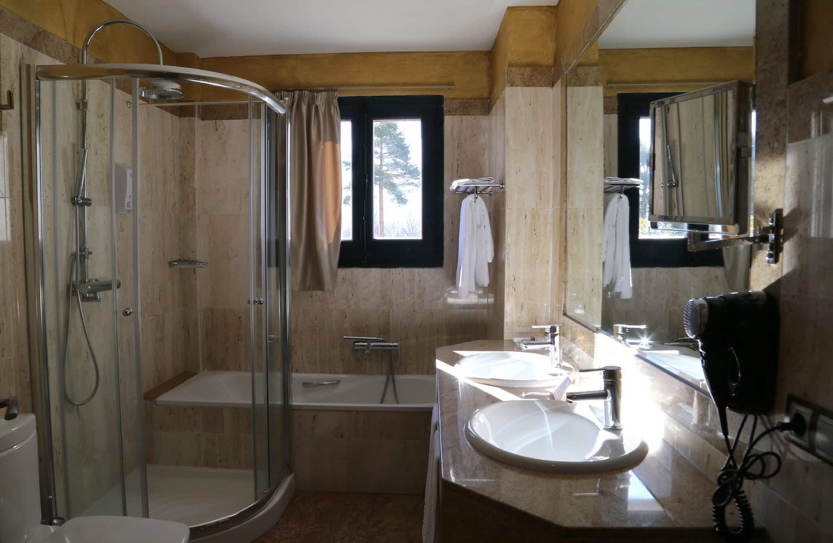 separate bathtub and shower, free toiletries, hair dryer, bathrobes