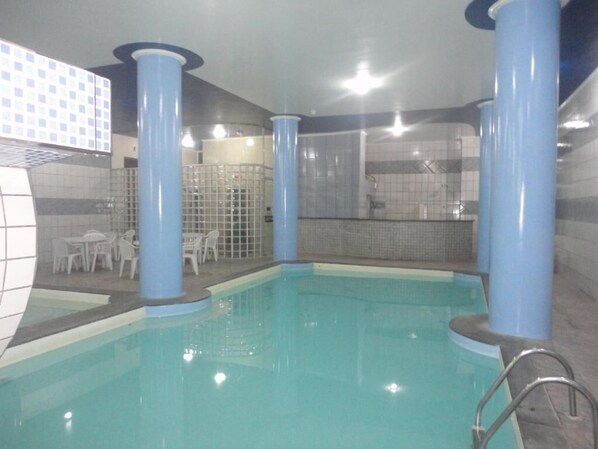 Indoor pool, outdoor pool, open 10:00 AM to 10:00 PM, pool umbrellas