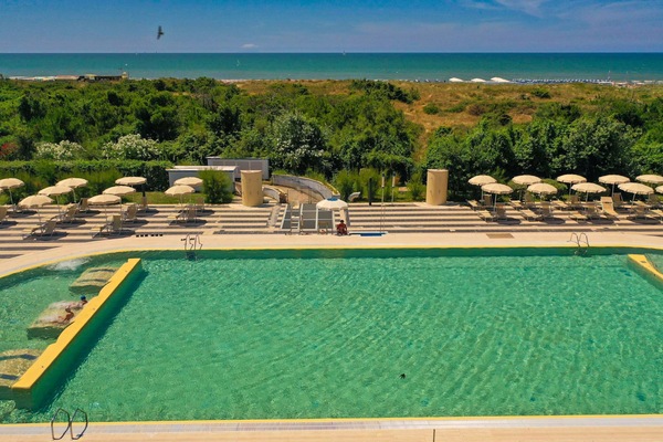 Seasonal outdoor pool, open 10:00 AM to 7:00 PM, pool umbrellas