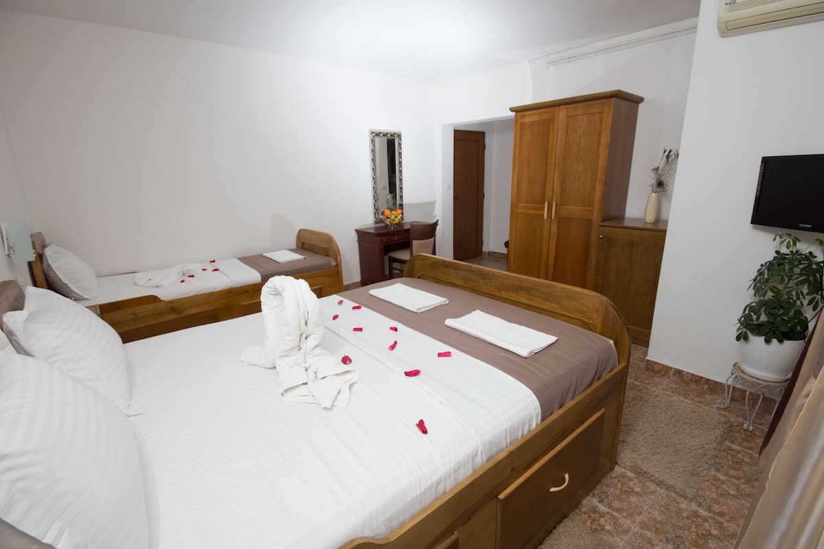 Triple Room, City View | Premium bedding, desk, WiFi (free), bed sheets