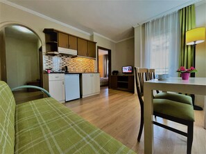 Family Apartment, 1 Bedroom, Kitchenette, Partial Sea View | Premium bedding, minibar, in-room safe, desk