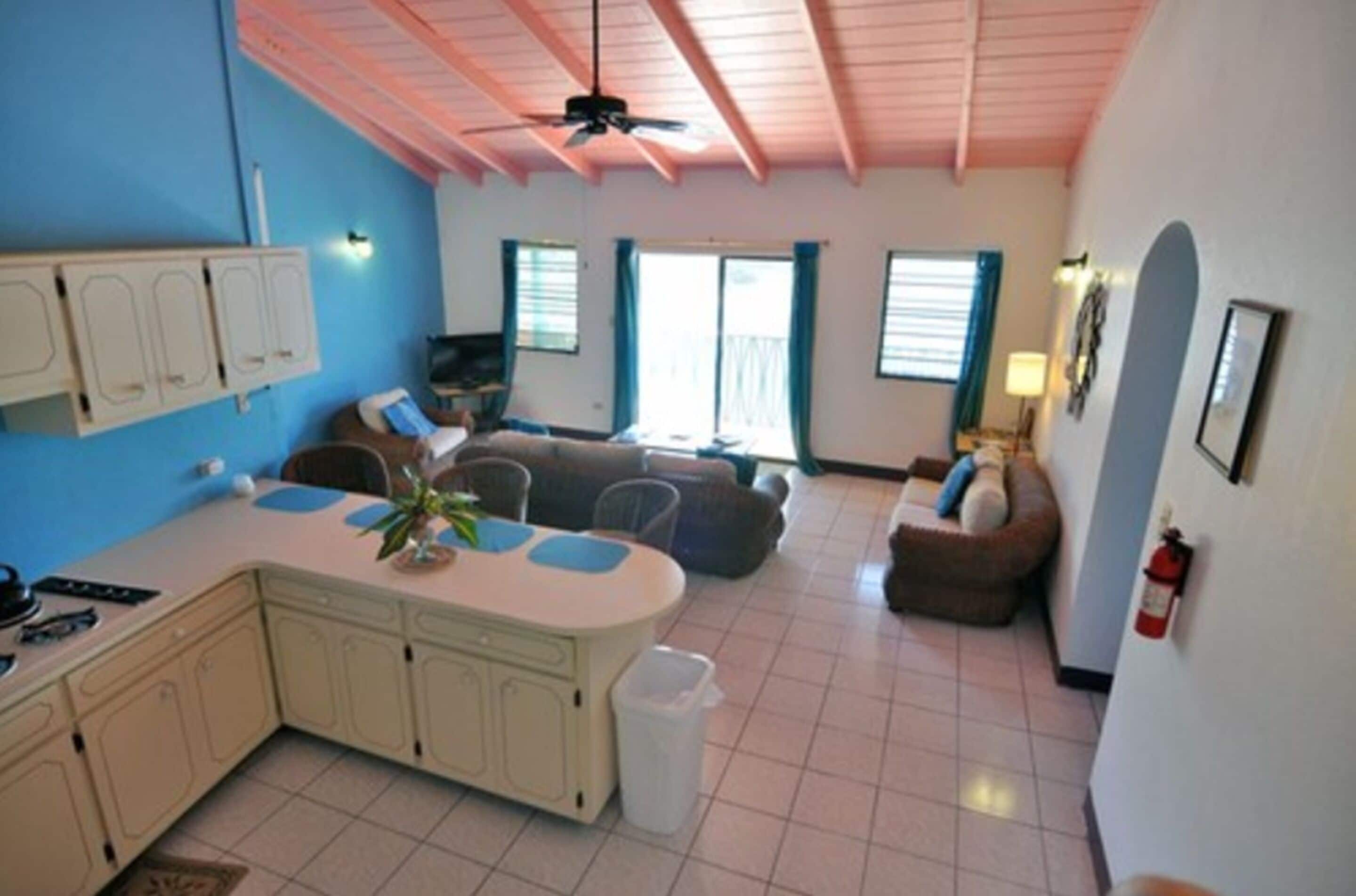 A compact living space with a kitchen, dining area, and seating area.