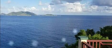 A coastal view with a clear sky and calm sea.