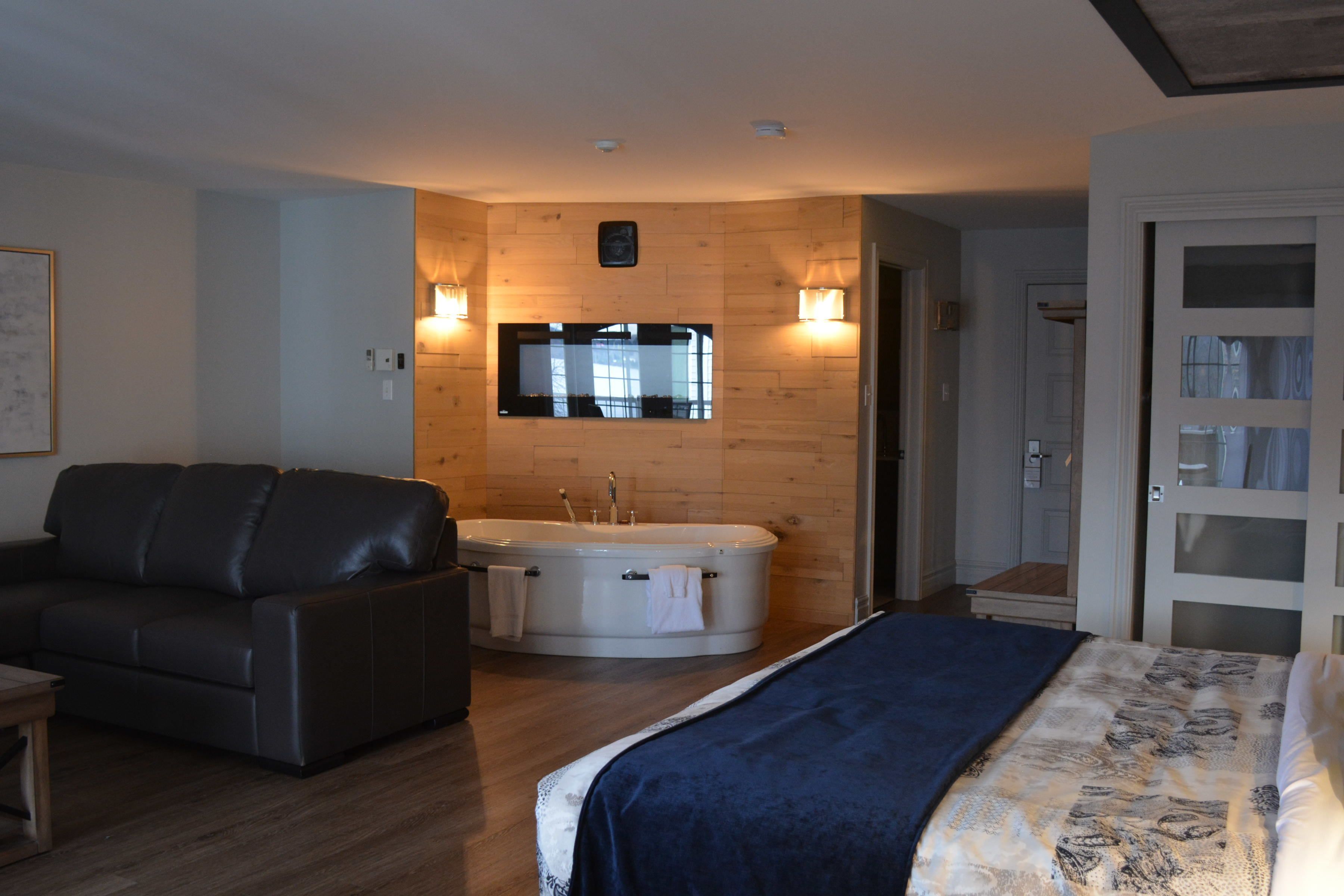 deluxe suite | premium bedding, in-room safe, desk, soundproofing