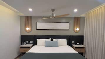 Desk, iron/ironing board, bed sheets