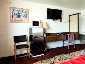 Minibar, desk, laptop workspace, iron/ironing board