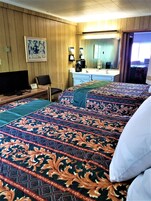 Family Triple Room | Minibar, desk, laptop workspace, iron/ironing board