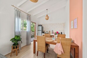 Comfort Apartment, 1 Bedroom, Garden View | Living area | 40-inch flat-screen TV with satellite channels, TV, toys - TUK Tropical Boutique Resort Jan Thiel (Jan Thiel)