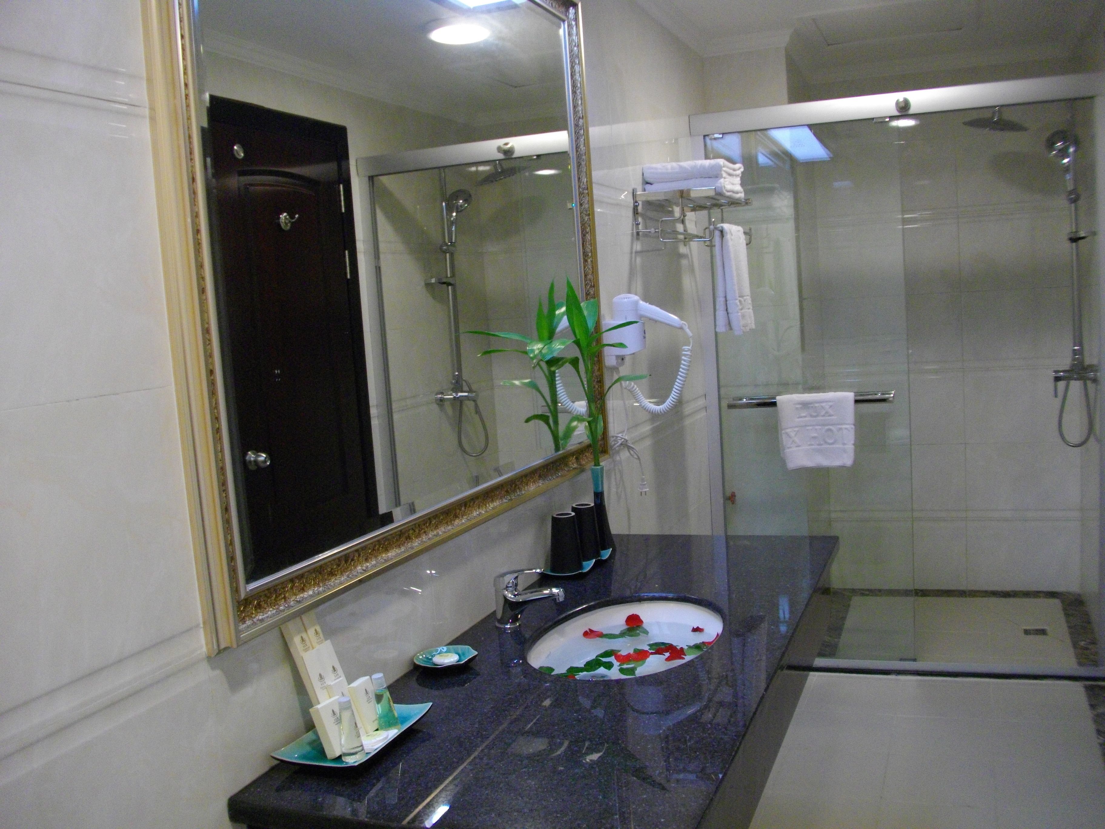 shower, free toiletries, slippers, towels